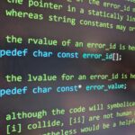 Founder reviewing AI-generated code on laptop, troubleshooting stuck build